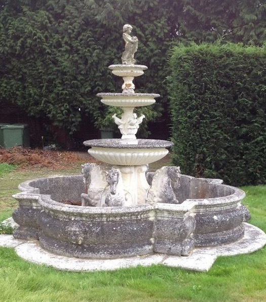 A large 18th century style reconstituted stone garden fountain, diam. 3.4m. H.2.5m